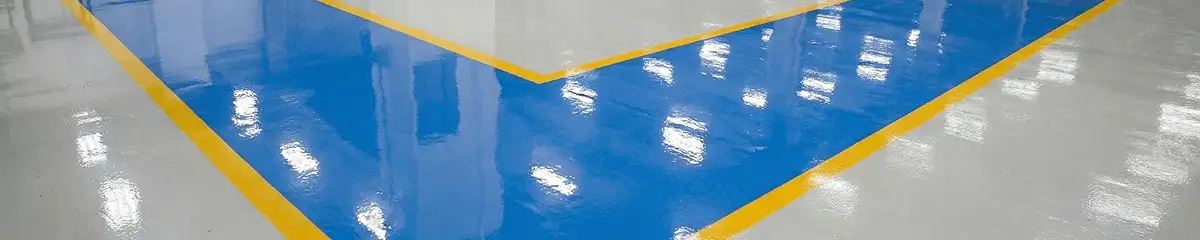 A factory floor professionally covered and marked with epoxy flooring in Memphis, TN