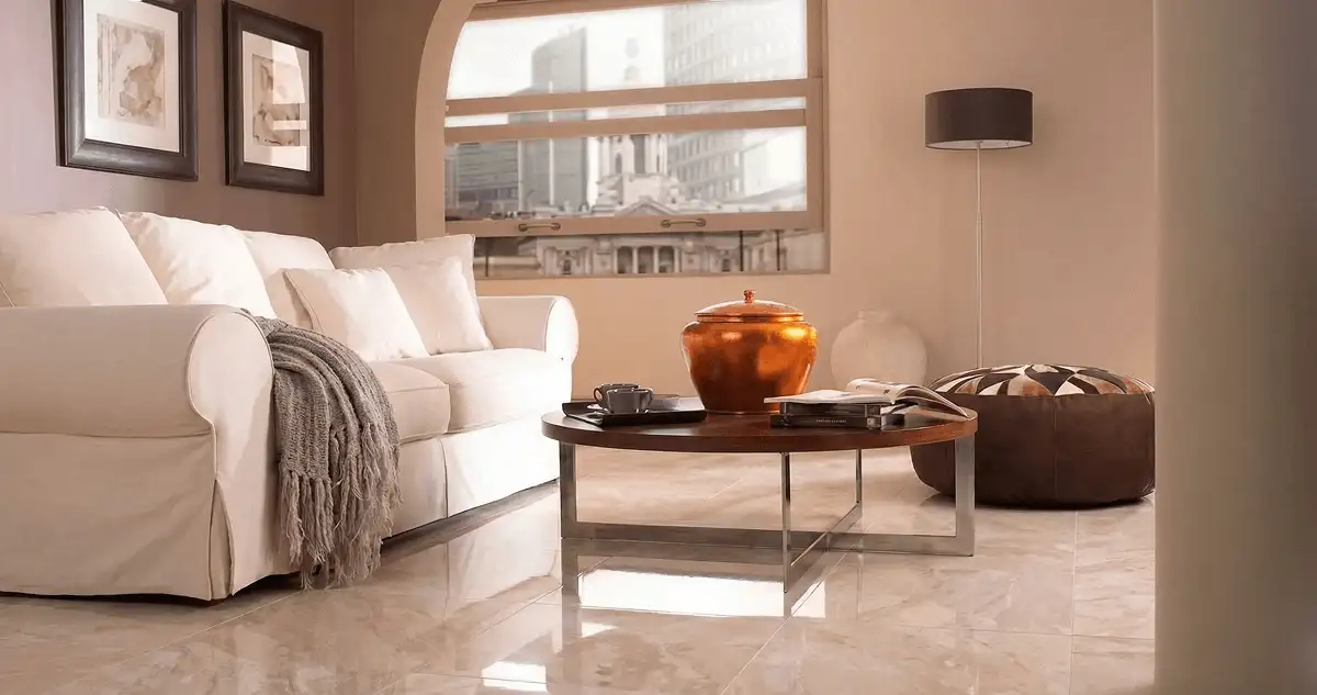 Modern living room with professionally installed marble flooring, a beige sofa, coffee table in Memphis, TN