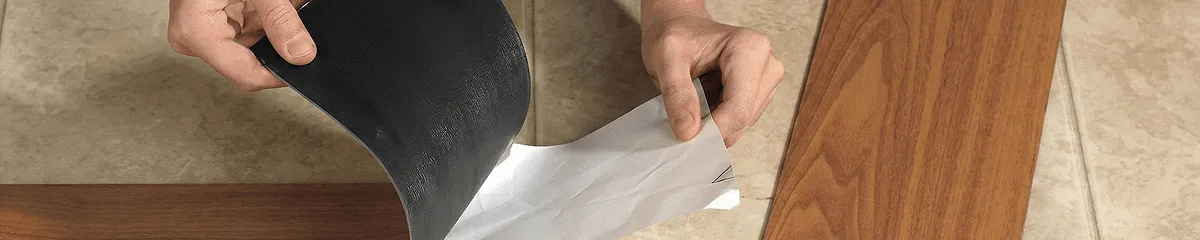 A professional installing vinyl flooring in Memphis, TN