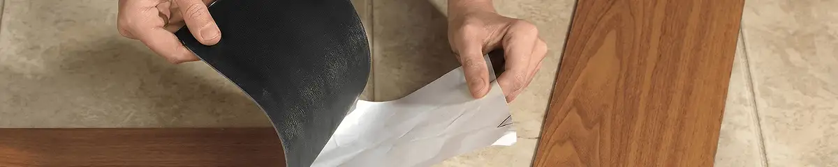 A professional installing vinyl flooring in Memphis, TN